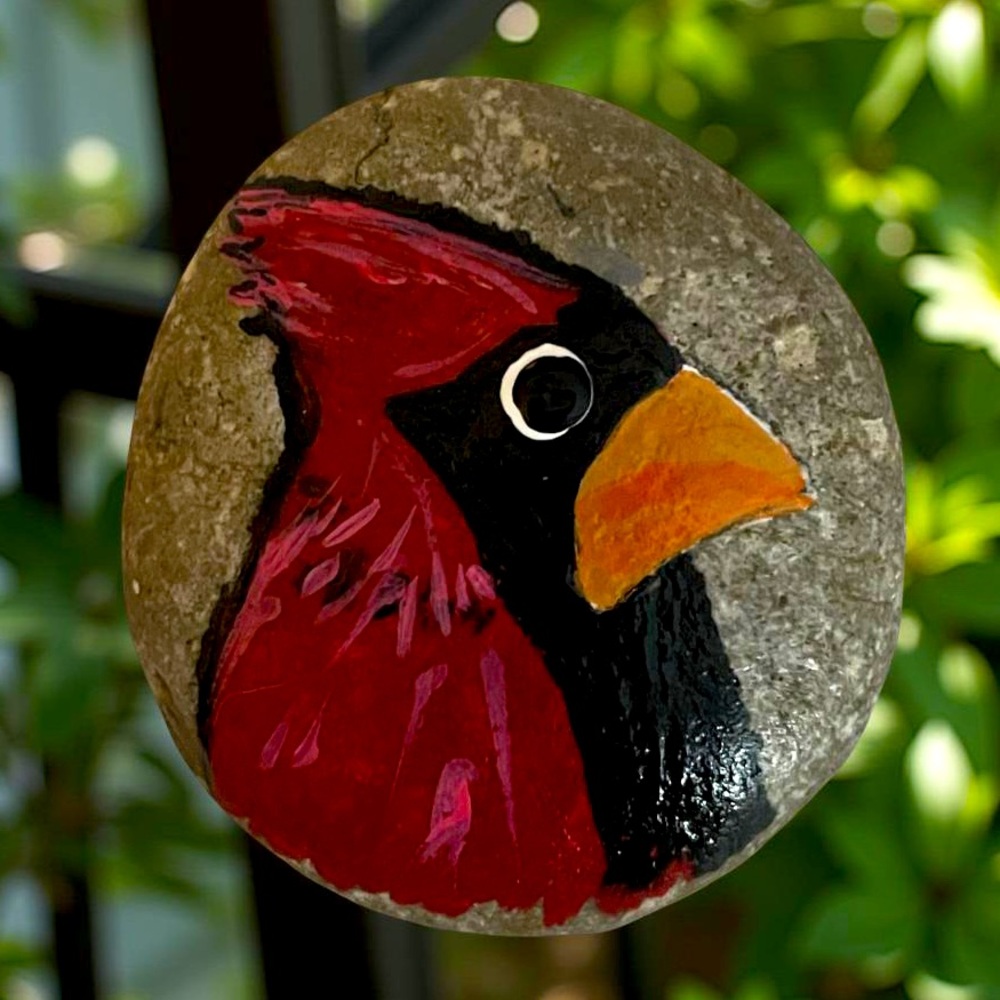 Hand crafted painted Cardinal rock red orange black brown natural background